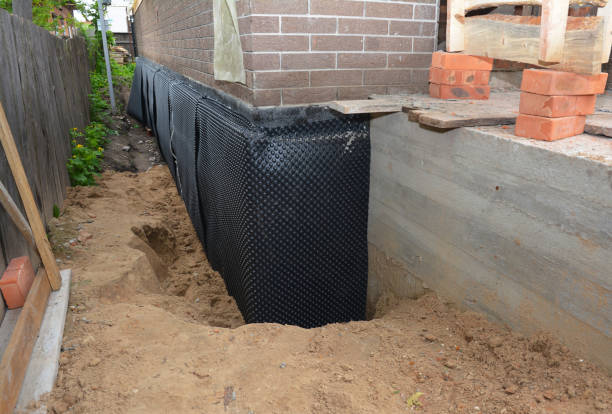 Happy homeowners after waterproofing job in Lyles